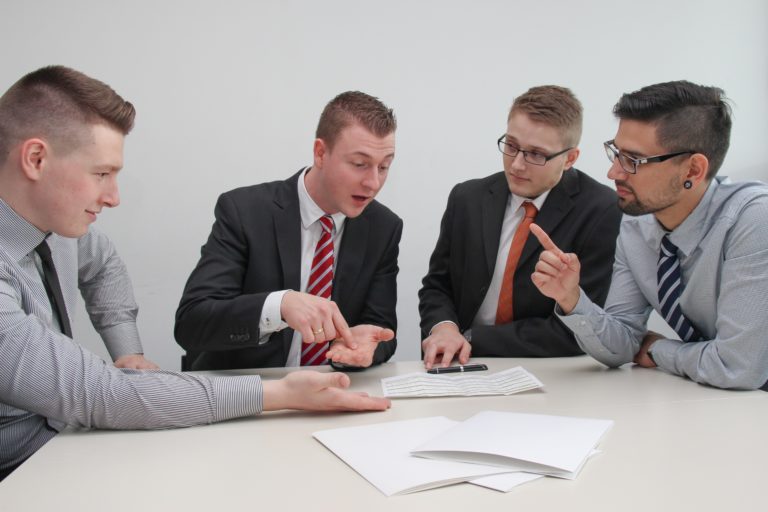 Group of corporate men discussing