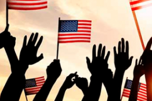 Silhouette hands holding US flag